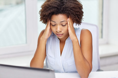 Women holding head with stress tension